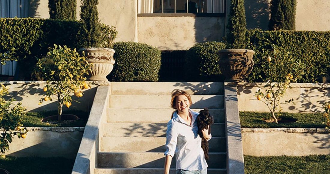 ellen pompeo plays with her toy poodles gigi and valentin, beside the swimming pool at her home in the hollywood hills